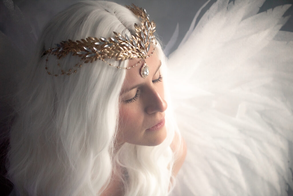 white cloud boudoir photoshoot as a fantasy creature